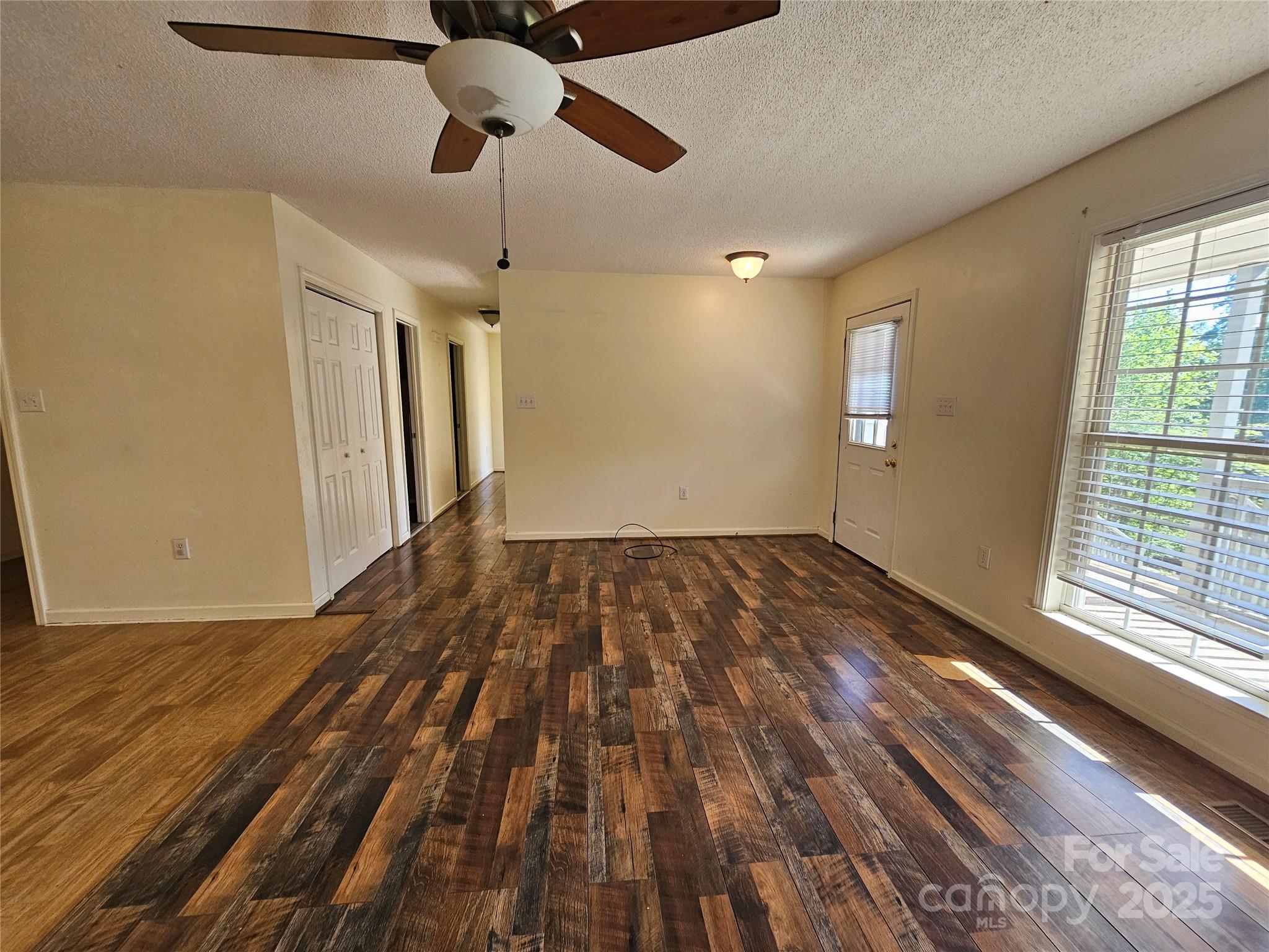 130 Susan Road, Unit 2 Casar, NC 28020 - Photo 5 of 12 a view of empty room with wooden floor and fan