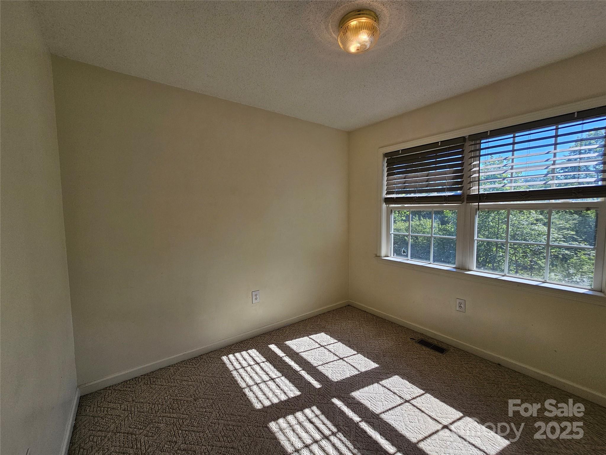 130 Susan Road, Unit 2 Casar, NC 28020 - Photo 7 of 12 an empty room with a window