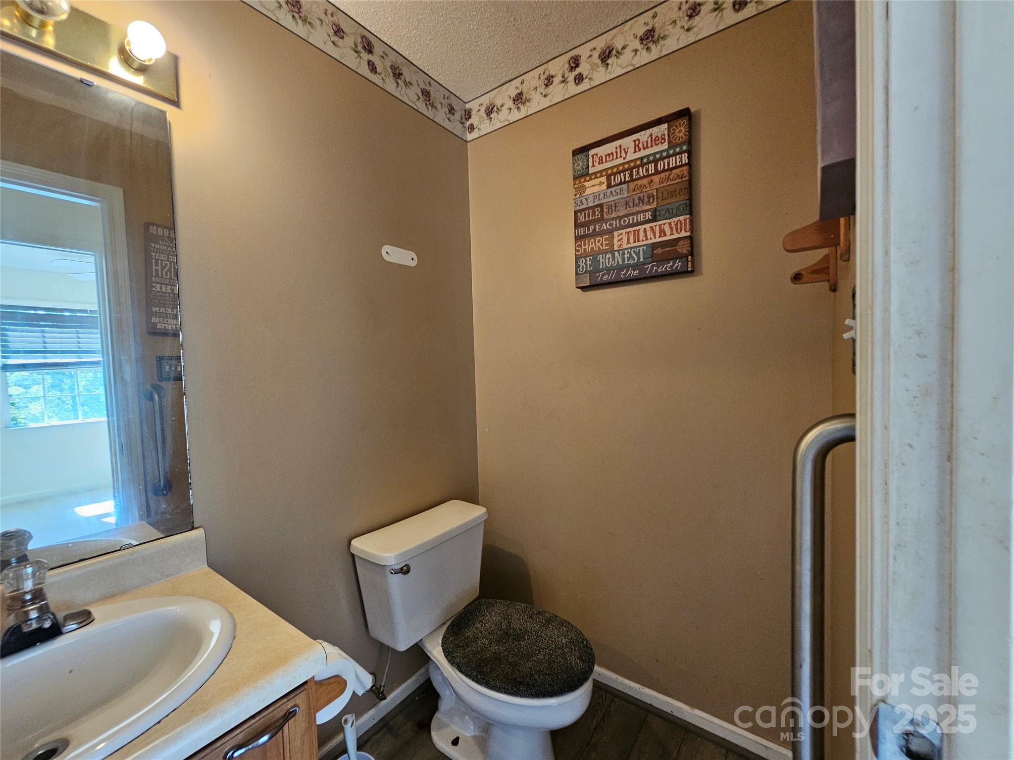 130 Susan Road, Unit 2 Casar, NC 28020 - Photo 8 of 12 a bathroom with a toilet and a sink