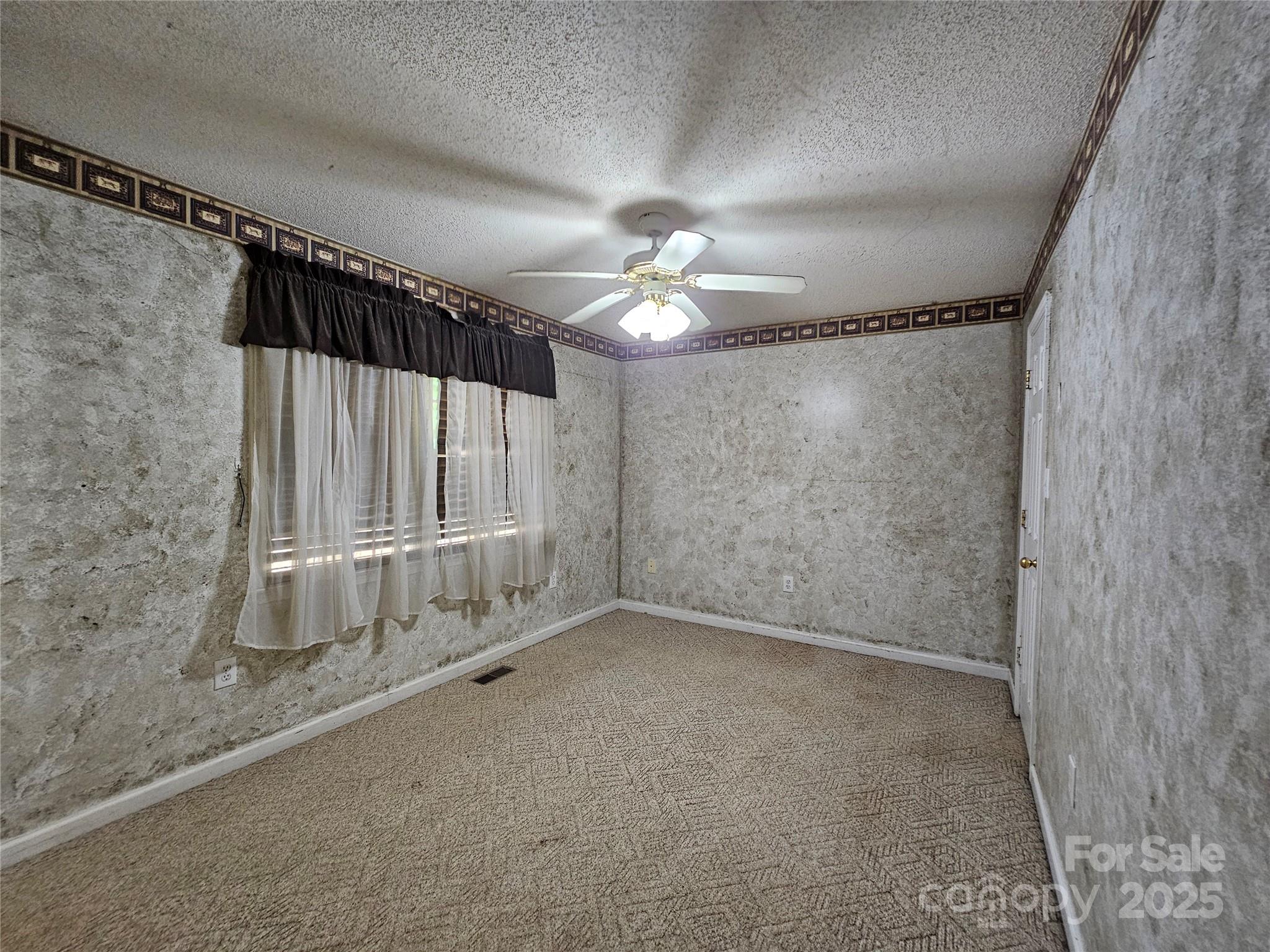 130 Susan Road, Unit 2 Casar, NC 28020 - Photo 10 of 12 a view of a room with a ceiling fan and window
