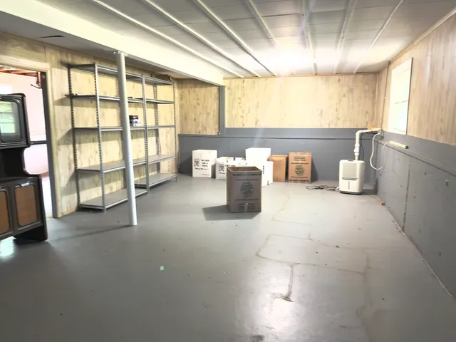 a lobby with furniture and floor to ceiling window