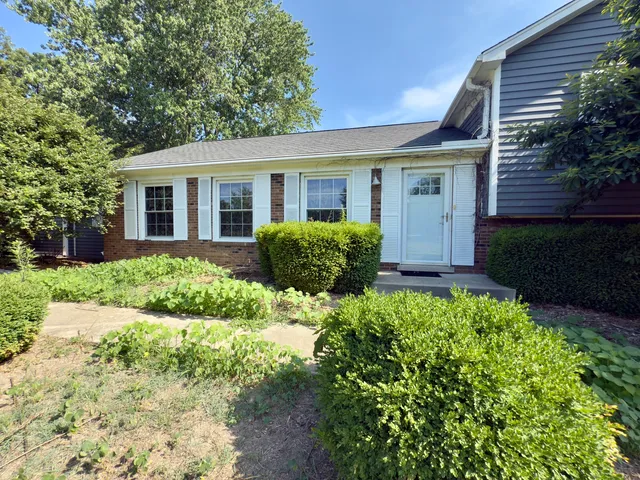 a view of a house with a garden