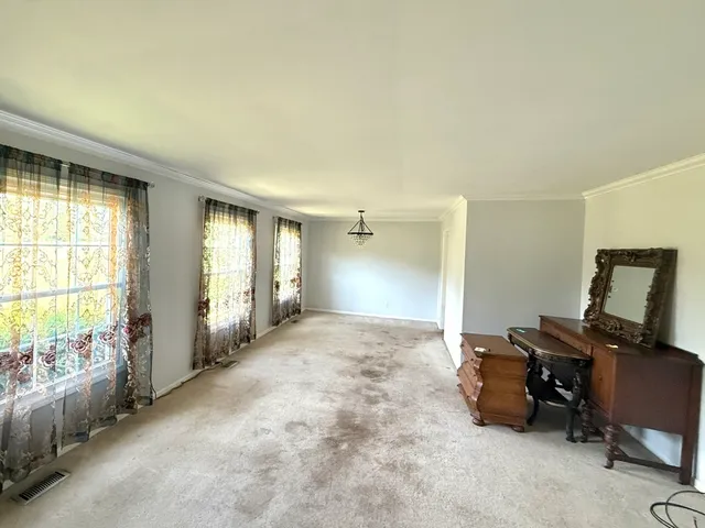 a view of a room with workspace and windows