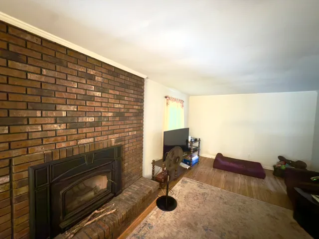 a workspace with furniture and a fireplace