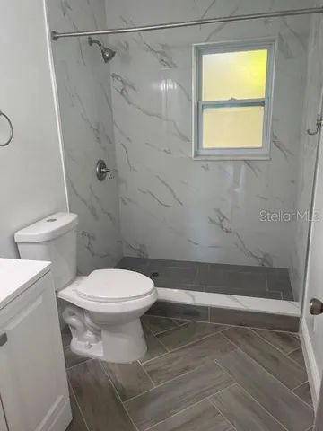 a view of a chandelier fan in a room