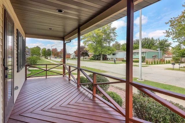 a view of a balcony with wooden floor