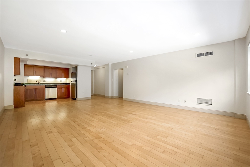 1600 Beacon Street, Unit 607 Brookline, MA 02446 - Photo 3 of 11 wooden floor in kitchen and a room with a kitchen