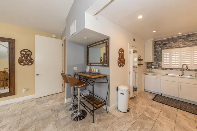 a kitchen with a sink cabinets and window