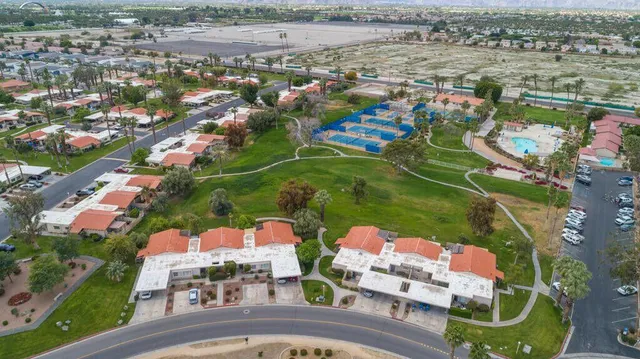 an aerial view of residential houses with outdoor space