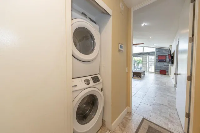a view of a hallway with washer and dryer