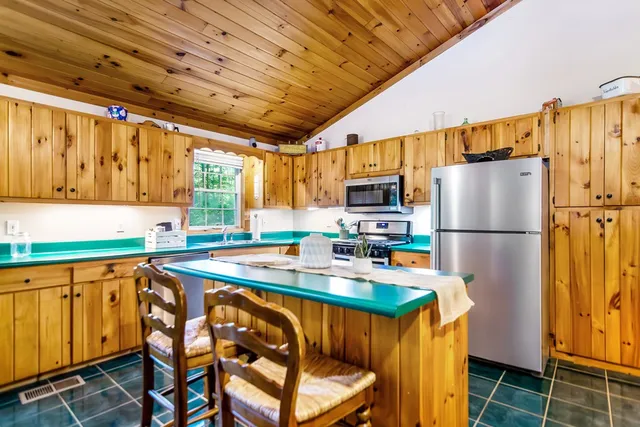 a view of kitchen with furniture and window