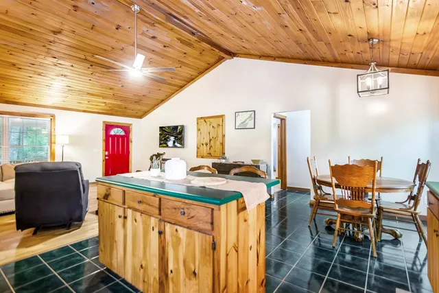 a kitchen with stainless steel appliances granite countertop a sink and cabinets