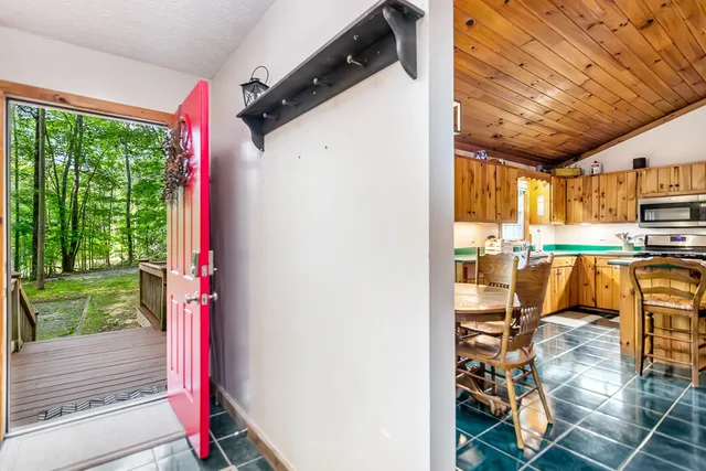 a balcony with furniture and wooden floor