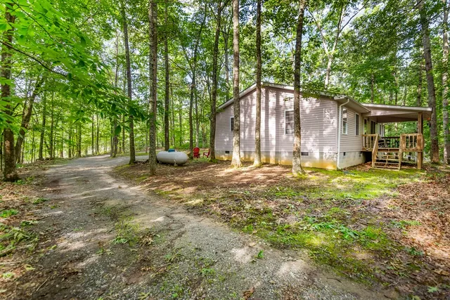 a backyard of a house with lots of green space