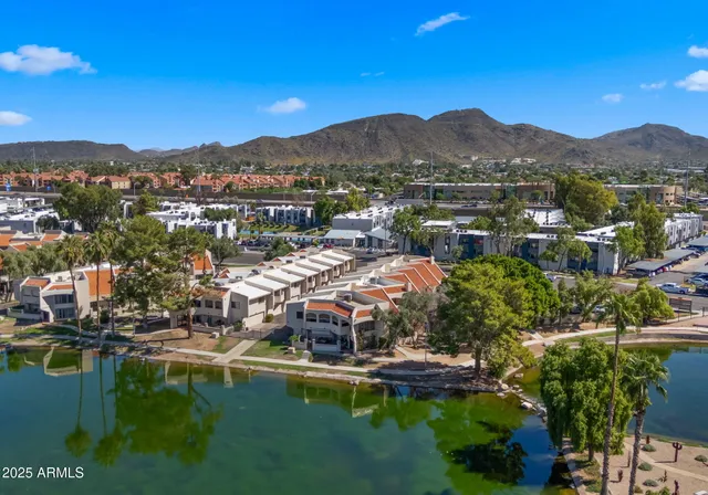 a view of a town with mountains in the background