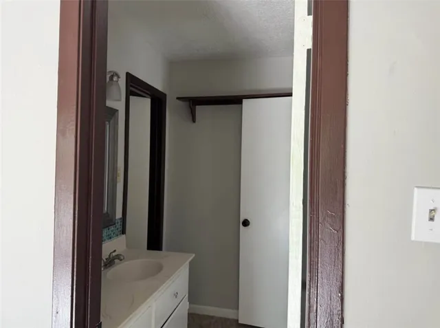 a bathroom with a tub and sink