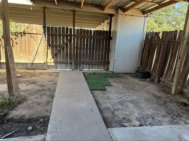 a view of backyard with green space