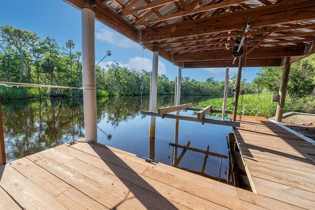 a view of a balcony with lake view and a floor to ceiling window