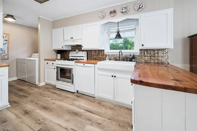 a white refrigerator freezer sitting inside of a kitchen
