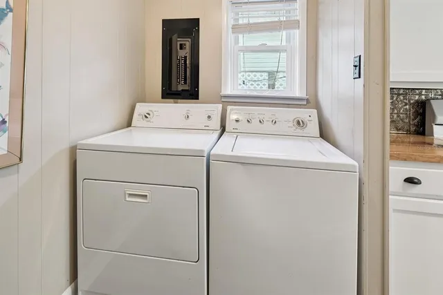 a kitchen with granite countertop a sink stove and refrigerator