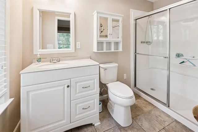 a bathroom with a shower and a toilet
