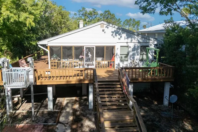 a view of a house with roof deck front of house