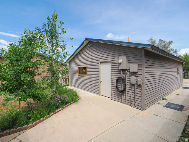 94 Spring Canyon Road Coalville, UT 84017 - Photo 15 of 50 Detached structure featuring horizontal siding, a single entry door, and a small framed window