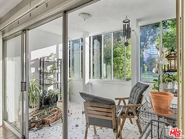 a outdoor dining space with furniture and garden view