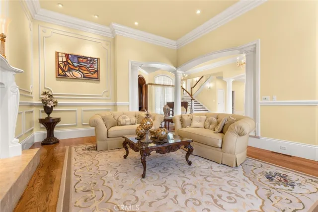 a bedroom with a bed a couch and a window