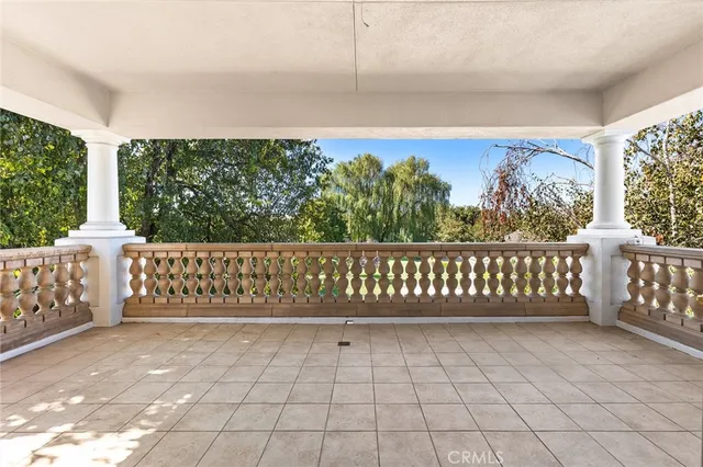 a bathroom with a granite countertop sink a toilet a mirror and shower