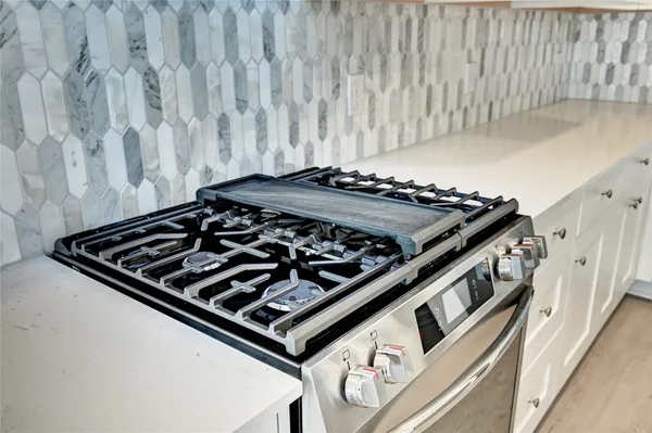 a close up of a stove in a kitchen