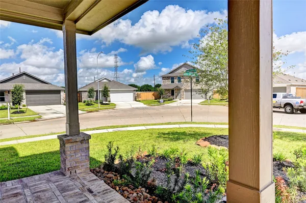 a view of a patio with a table and chairs