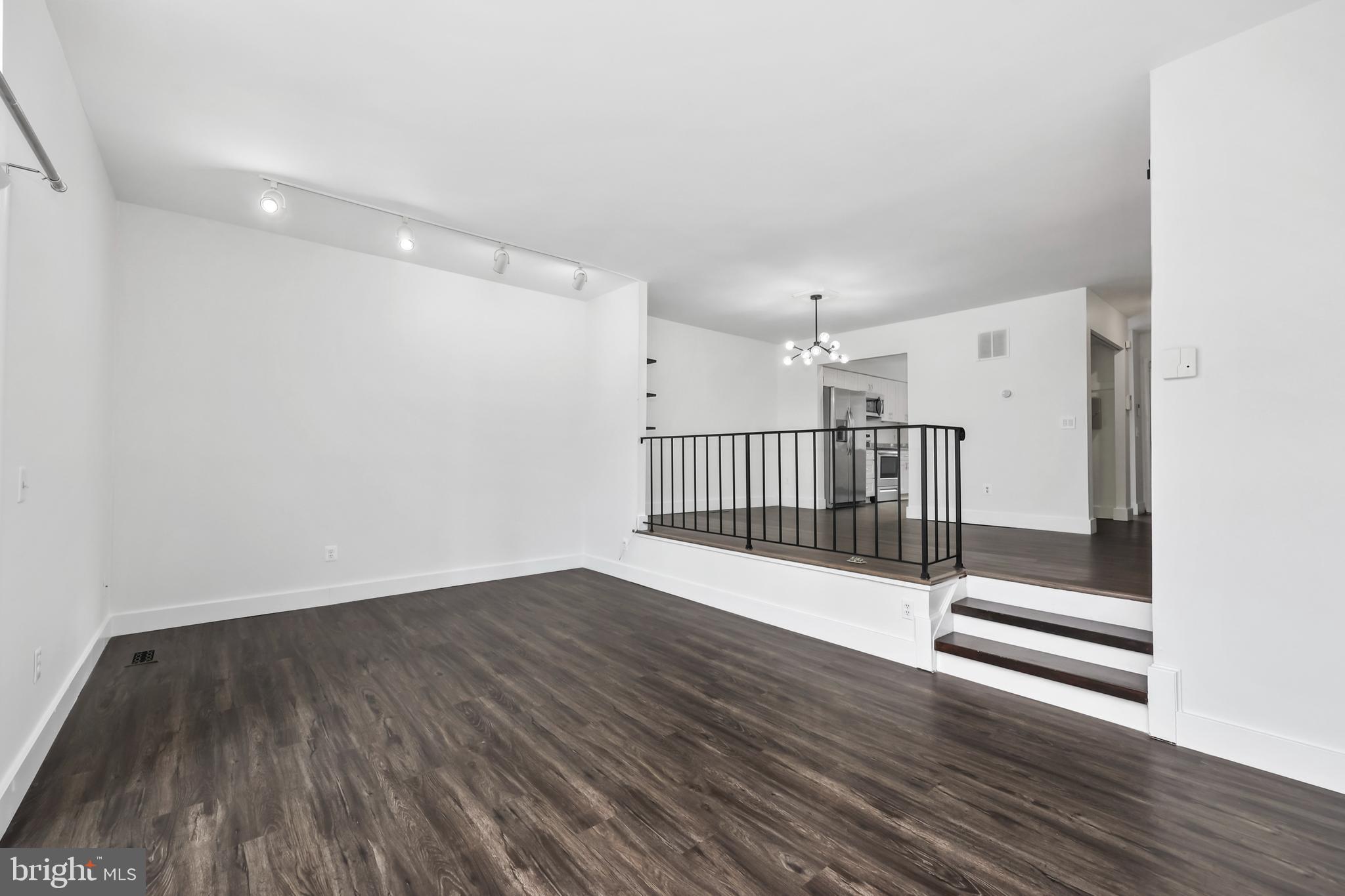 11711 Decade Court Reston, VA 20191 - Photo 11 of 44 a view of a hallway with wooden floor