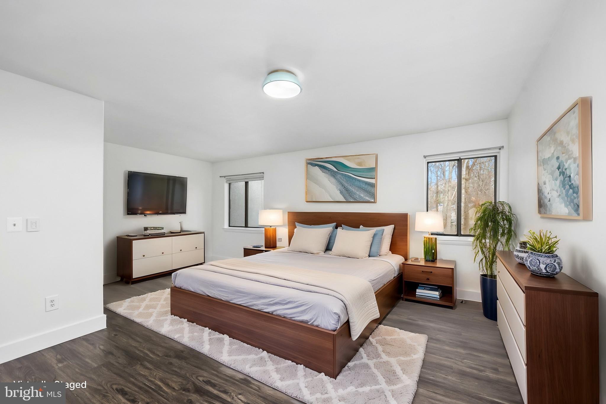 11711 Decade Court Reston, VA 20191 - Photo 13 of 44 a bedroom with a large bed and a flat screen tv