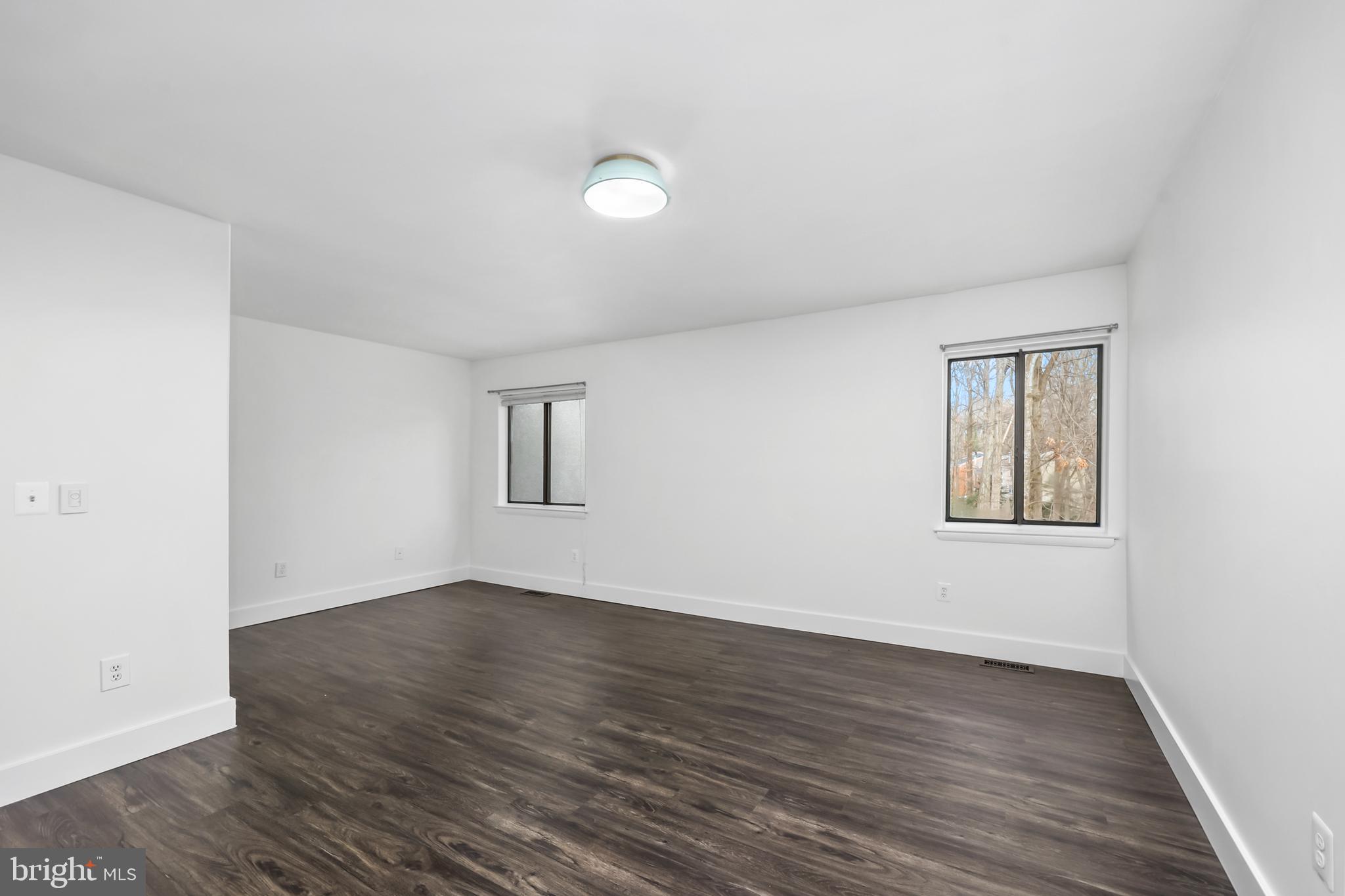 11711 Decade Court Reston, VA 20191 - Photo 14 of 44 an empty room with wooden floor and windows