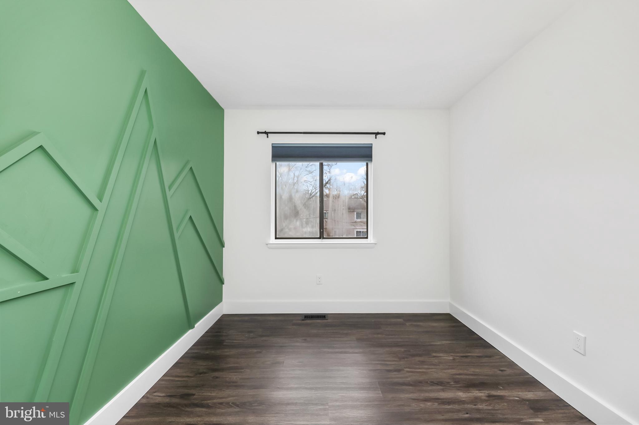 11711 Decade Court Reston, VA 20191 - Photo 18 of 44 a view of a room that has wooden floor and a window