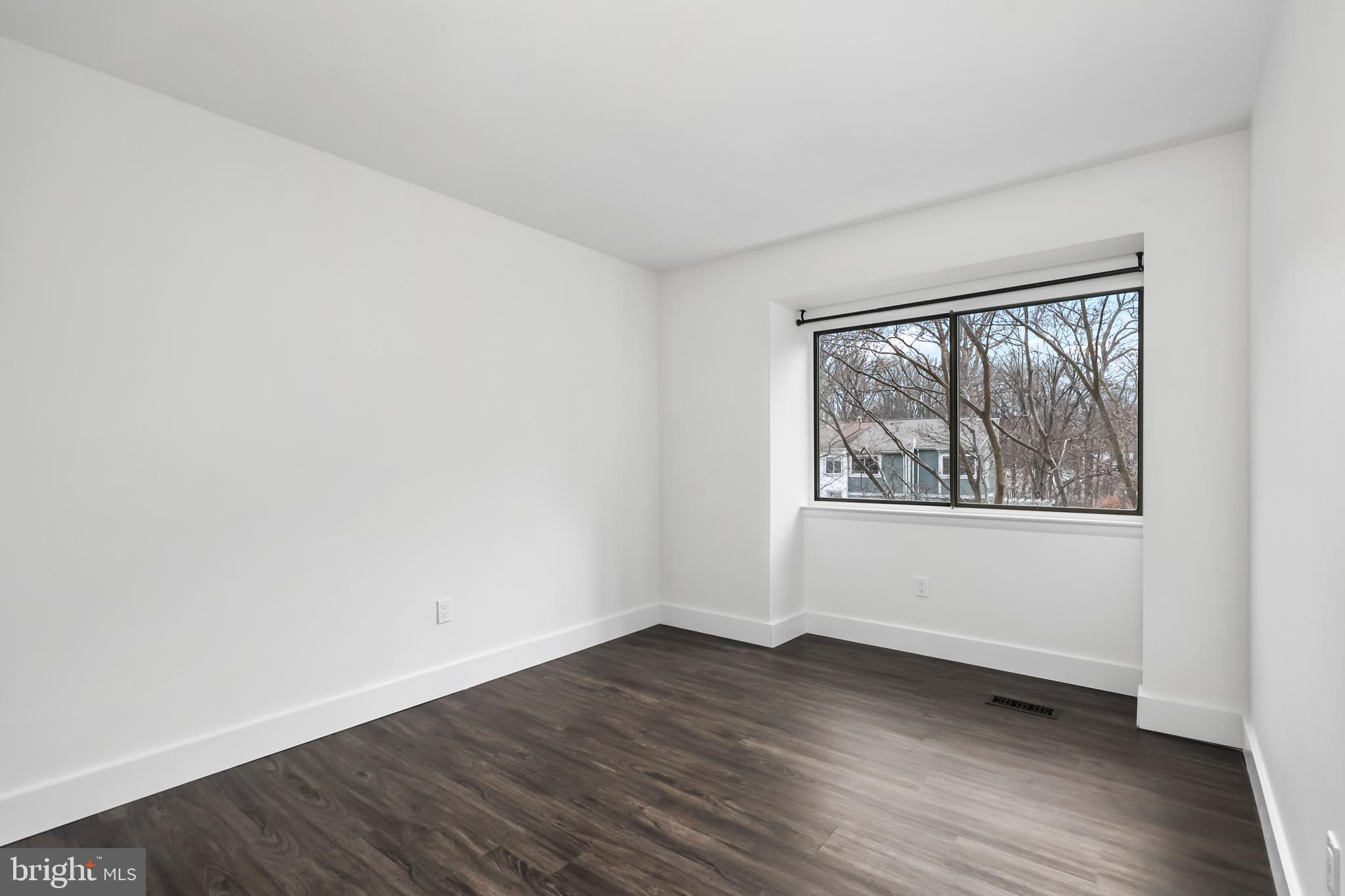 11711 Decade Court Reston, VA 20191 - Photo 20 of 44 an empty room with wooden floor and windows
