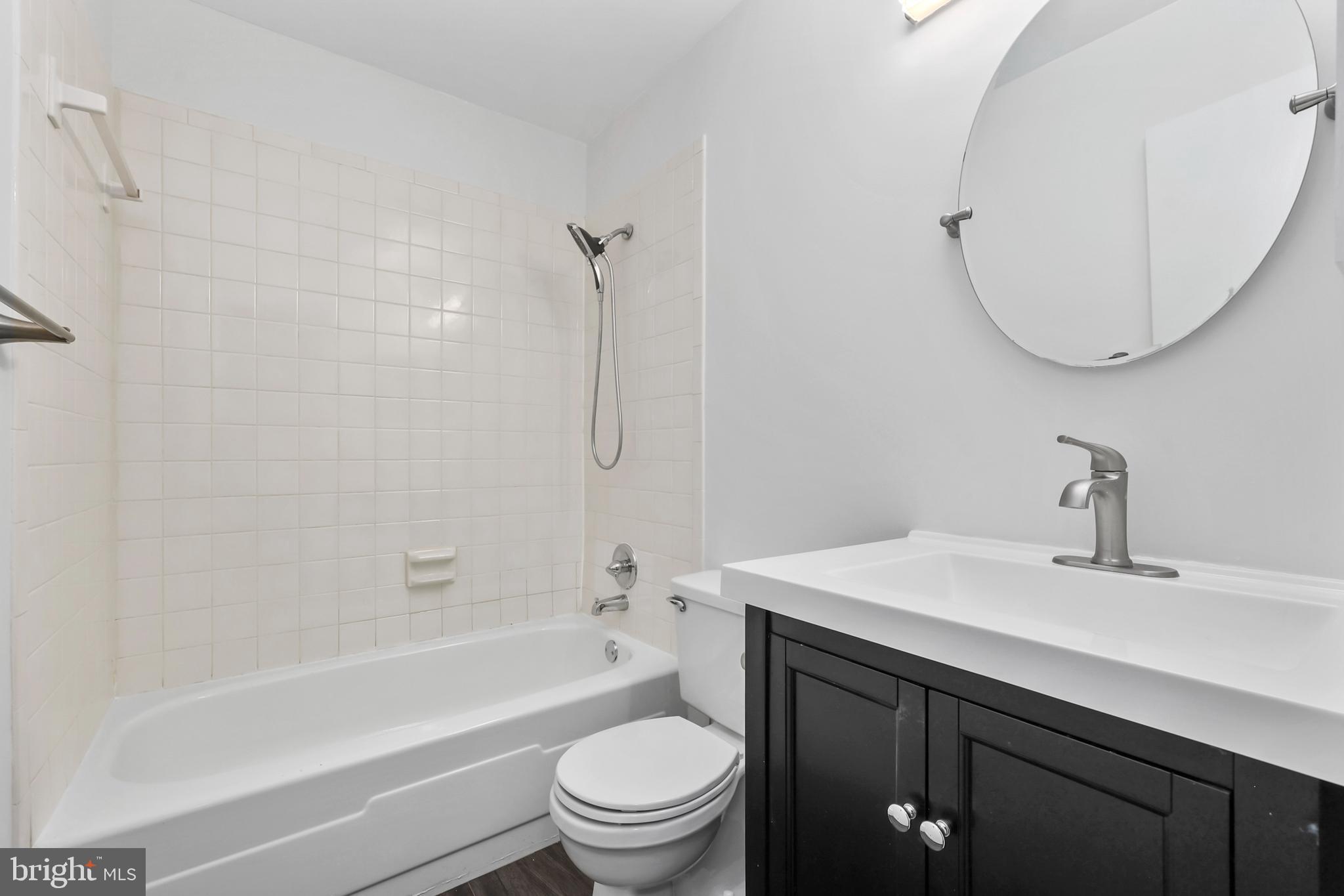 11711 Decade Court Reston, VA 20191 - Photo 22 of 44 a bathroom with a sink a toilet and a mirror