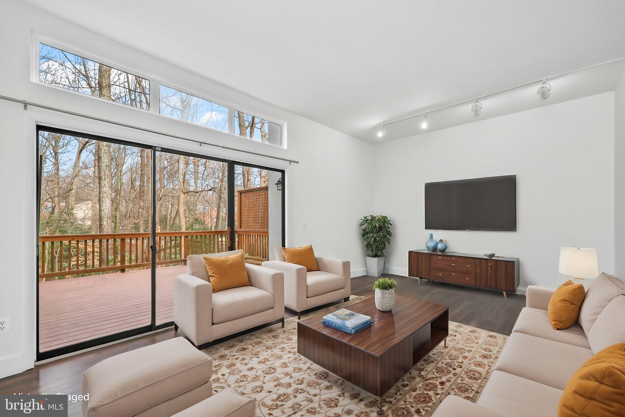 11711 Decade Court Reston, VA 20191 - Photo 3 of 44 a living room with furniture and a flat screen tv