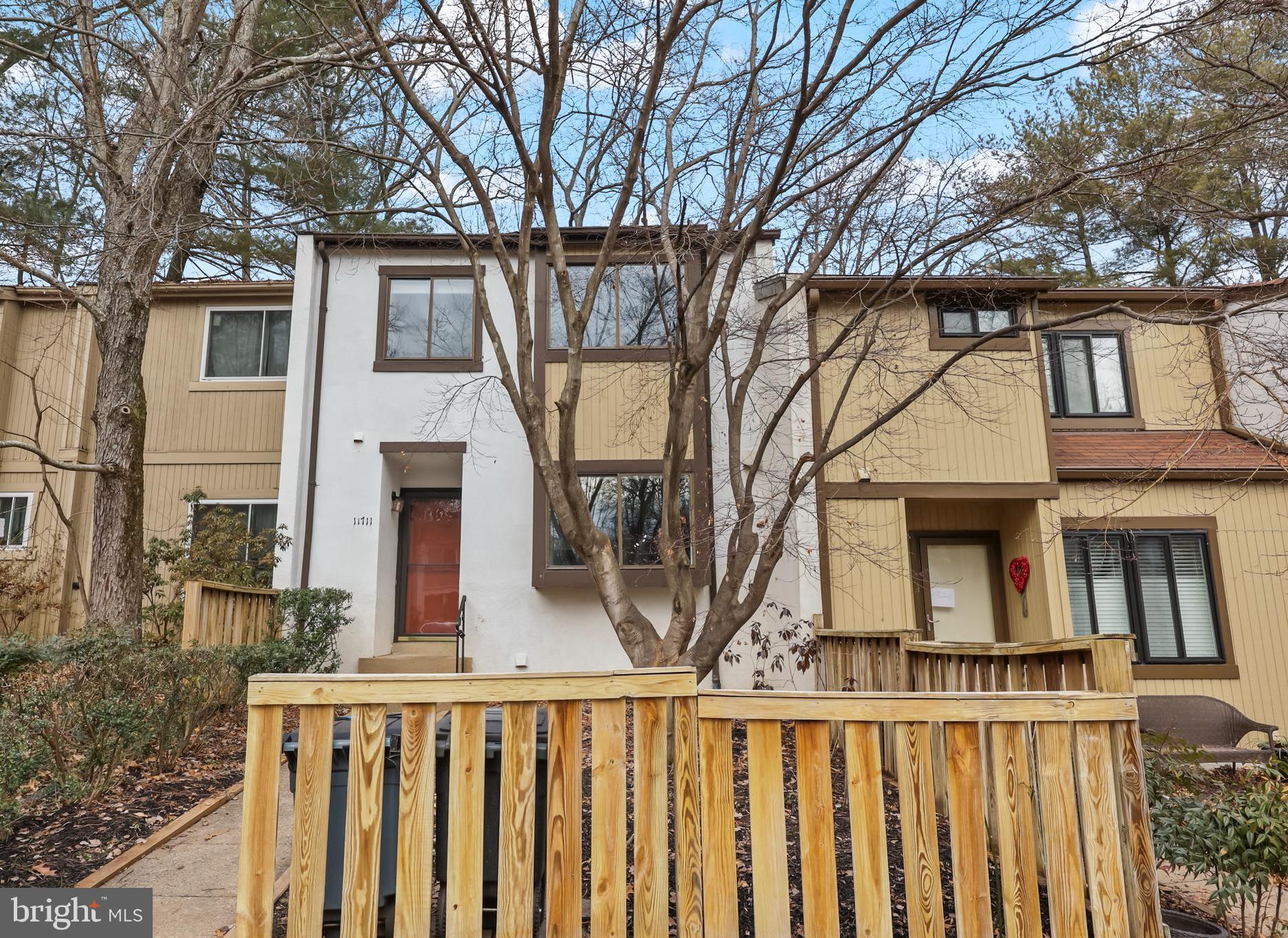 11711 Decade Court Reston, VA 20191 - Photo 33 of 44 a view of a house with wooden fence