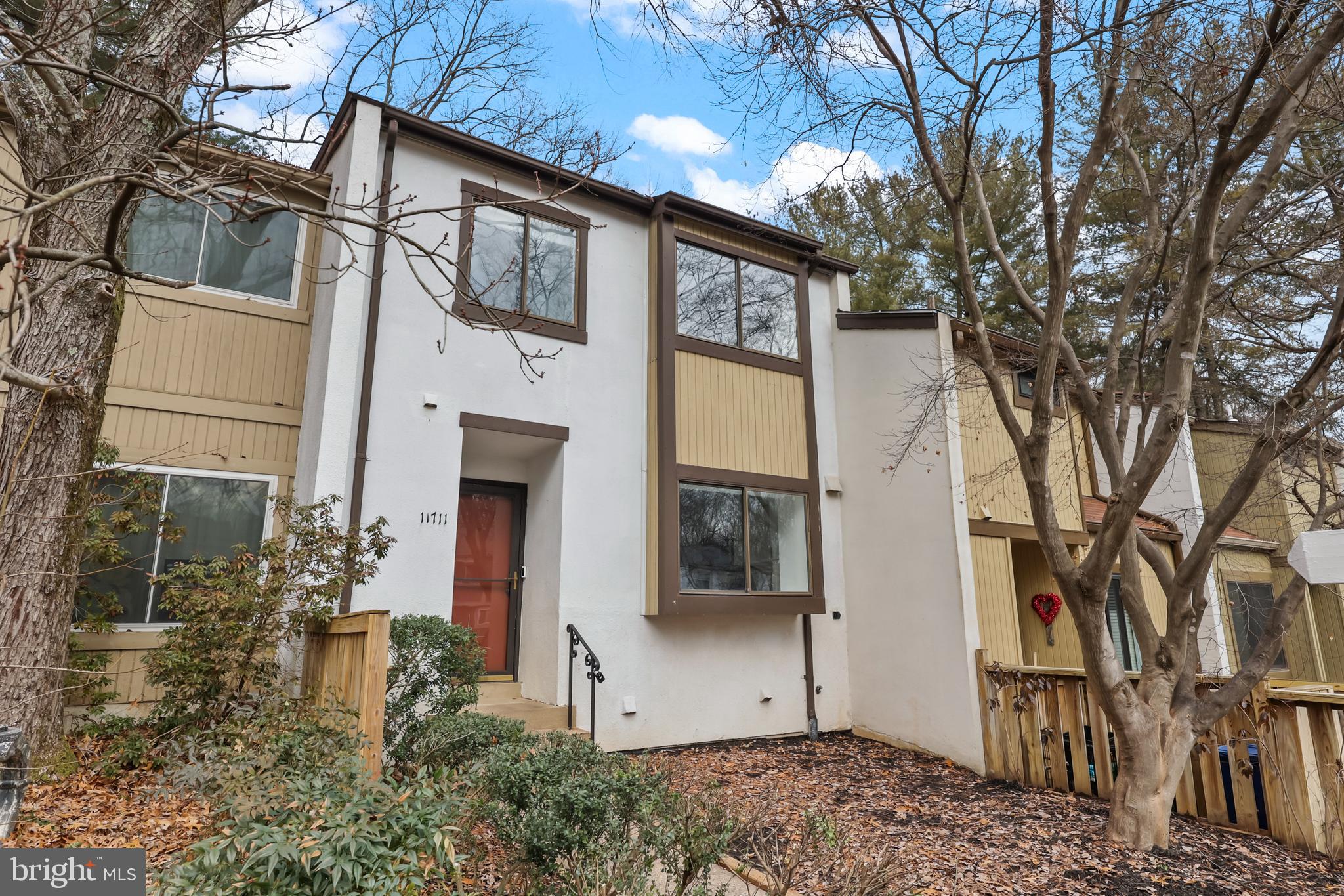 11711 Decade Court Reston, VA 20191 - Photo 34 of 44 a front view of a house with garden