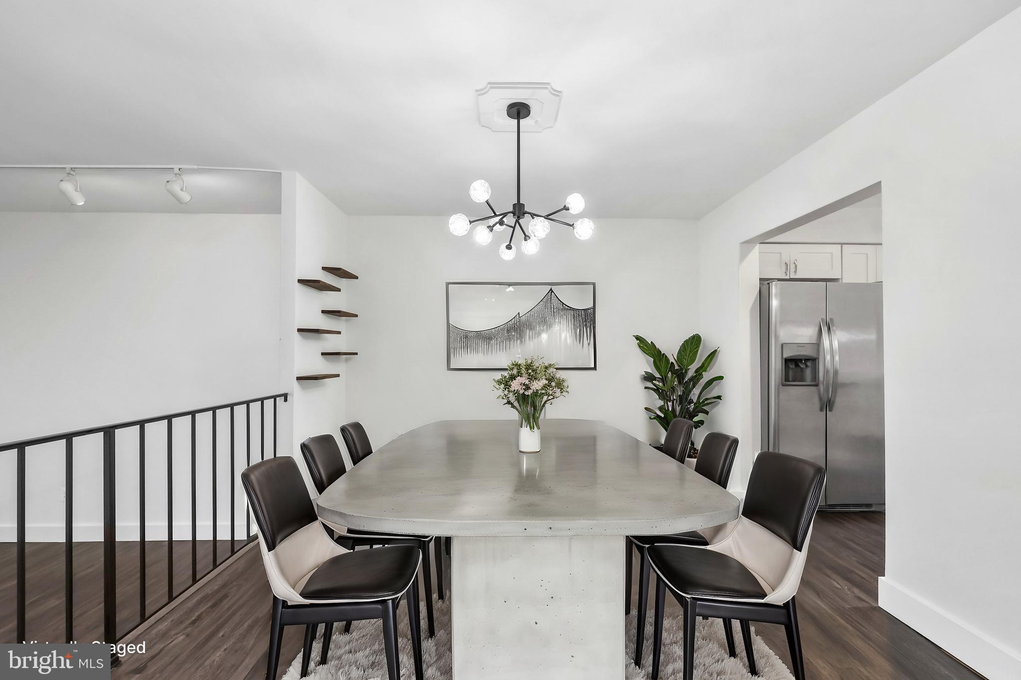 11711 Decade Court Reston, VA 20191 - Photo 4 of 44 a view of a dining room with furniture and wooden floor