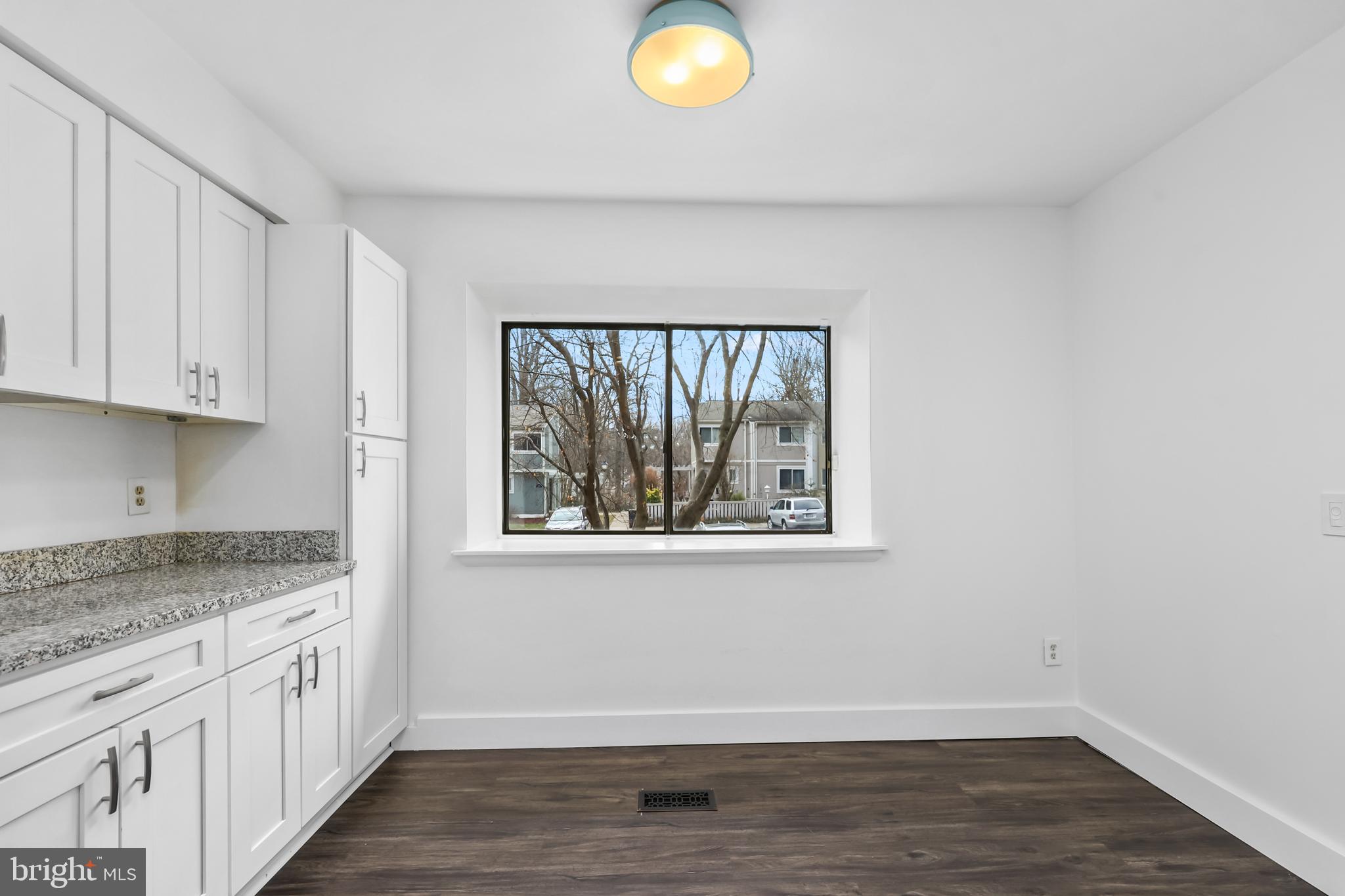 11711 Decade Court Reston, VA 20191 - Photo 6 of 44 an empty room with wooden floor and window