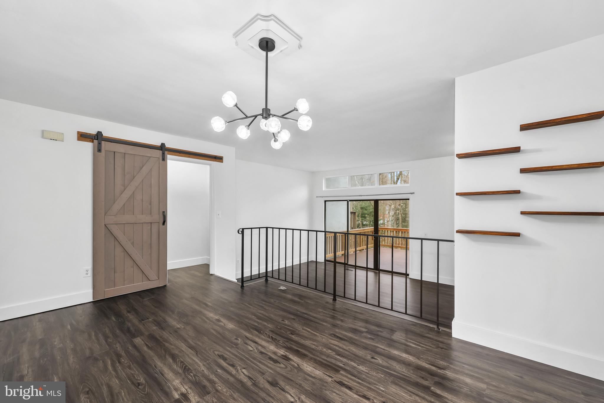 11711 Decade Court Reston, VA 20191 - Photo 9 of 44 a view of a livingroom with wooden floor