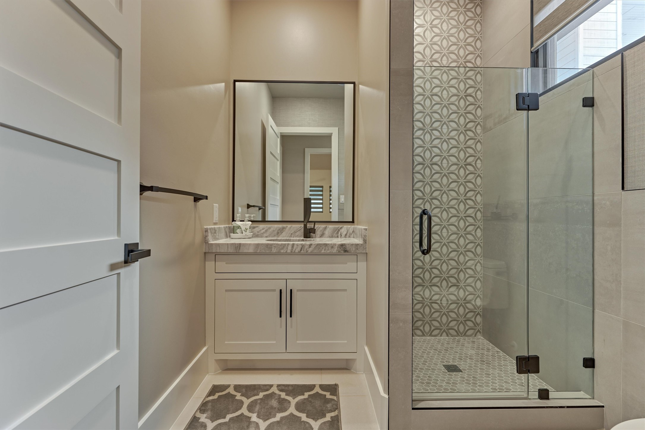 1907 Woerner Road Houston, TX 77090 - Photo 28 of 50 One of two full baths featuring upgraded Quartzite countertops and walk-in shower.