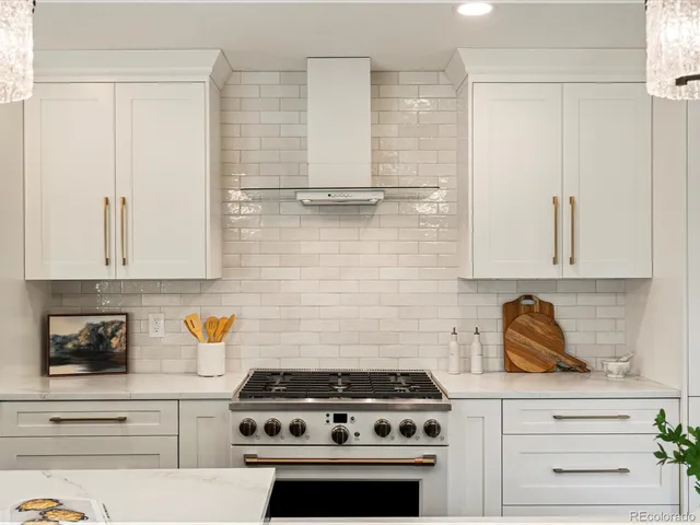 a dining room with wooden floor a table and chairs