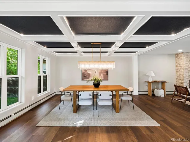 a view of a livingroom with furniture wooden floor and a window