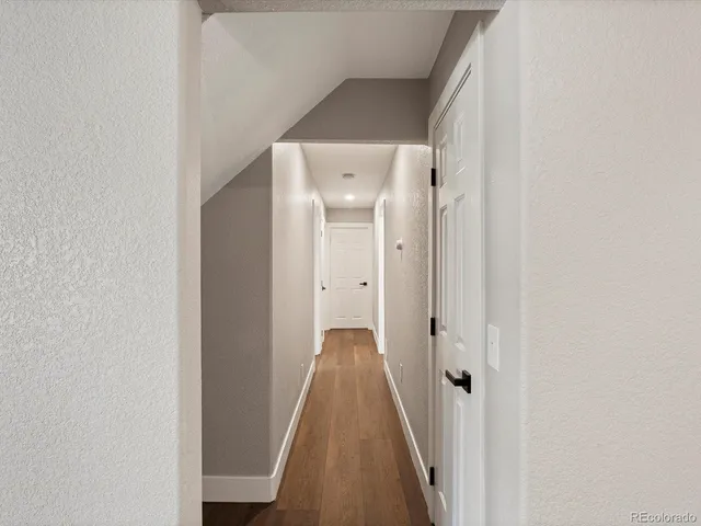 a living room with furniture a rug and a window