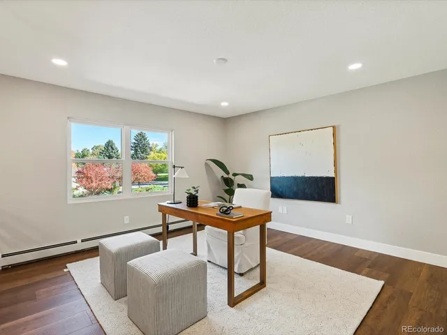 a living room with furniture and a rug
