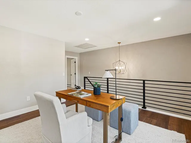 a bedroom with a bed and potted plant